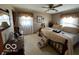 Cozy bedroom with carpet, a ceiling fan, and comfortable furnishings for a relaxing retreat at 2227 S County Road 300 E, Danville, IN 46122