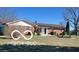 Charming brick home featuring a well-maintained front yard and mature landscaping at 2227 S County Road 300 E, Danville, IN 46122