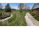 Green front lawn with rock-lined walkway and well-maintained landscaping at 2227 S County Road 300 E, Danville, IN 46122