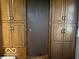 Hallway with wooden built-in cabinets and a door at 2227 S County Road 300 E, Danville, IN 46122