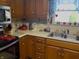 Vintage kitchen with wood cabinets and a stainless steel sink at 2227 S County Road 300 E, Danville, IN 46122