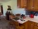 Eat-in kitchen with wooden chairs, cabinets, and a cozy atmosphere at 2227 S County Road 300 E, Danville, IN 46122