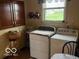 Functional laundry room with washer, dryer, and overhead cabinets at 2227 S County Road 300 E, Danville, IN 46122