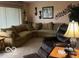 Comfortable living room features a large sectional sofa and warm lighting at 2227 S County Road 300 E, Danville, IN 46122