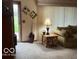 Cozy living area with natural light, sofa, and accent table at 2227 S County Road 300 E, Danville, IN 46122