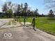 Outdoor area with hoses, grassy field, and trees in the background at 2227 S County Road 300 E, Danville, IN 46122