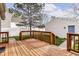Back deck with wood railings overlooks the backyard and detached garage at 2615 N Delaware St, Indianapolis, IN 46205