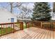 Back deck with wood railings overlooking the backyard and detached garage at 2615 N Delaware St, Indianapolis, IN 46205