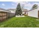 View of a backyard with firepit and seating and a detached garage at 2615 N Delaware St, Indianapolis, IN 46205