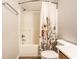 Bathroom features a tub with shower and decorative floral curtain at 2615 N Delaware St, Indianapolis, IN 46205