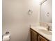 Bathroom features a vanity sink with a mirror, toilet paper holder and towel ring at 2615 N Delaware St, Indianapolis, IN 46205