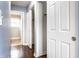 This is a closet with white doors and a view into the bathroom at 2615 N Delaware St, Indianapolis, IN 46205