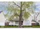 Charming two-story home with a covered porch and mature trees at 2615 N Delaware St, Indianapolis, IN 46205