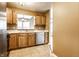 This kitchen has light wood cabinetry, stainless steel appliances, and a serving window at 2615 N Delaware St, Indianapolis, IN 46205