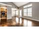Open-concept living room with hardwood floors, vaulted ceiling, and a view into the kitchen at 2615 N Delaware St, Indianapolis, IN 46205