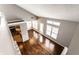 View of the living room with hardwood floors, cathedral ceilings, and an open layout at 2615 N Delaware St, Indianapolis, IN 46205