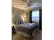 Bedroom with a ceiling fan, a comfortable bed, and natural light through the window at 2715 Prosperity Dr, Columbus, IN 47201