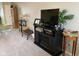 Living room featuring a TV atop a fireplace console, decorative accessories, and neutral carpeting at 2715 Prosperity Dr, Columbus, IN 47201