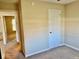 Comfortable bedroom with access to a bathroom and kitchen through doorways, enhancing convenience and flow at 305 S Schroeder Rd, Muncie, IN 47304