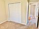 View of bedroom featuring a closet and doorway to another room at 305 S Schroeder Rd, Muncie, IN 47304
