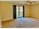 Bright bedroom with a sliding glass door that leads to a backyard deck, offering seamless outdoor access at 305 S Schroeder Rd, Muncie, IN 47304