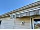 Exterior shot of the house with an awning at 305 S Schroeder Rd, Muncie, IN 47304