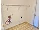 Laundry room includes washer hookups, shelving, and neutral flooring at 305 S Schroeder Rd, Muncie, IN 47304