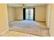 Inviting living room with sliding glass doors to the back, offering bright light and seamless flow at 305 S Schroeder Rd, Muncie, IN 47304