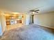 Open concept living area showcasing a seamless transition to the well-lit kitchen at 305 S Schroeder Rd, Muncie, IN 47304