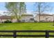 Spacious backyard with lush green grass and a secure black fence, perfect for outdoor activities at 350 Springfield Cir, Greenwood, IN 46143