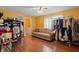 Versatile room setup with a workstation, closet and comfortable tan couch at 350 Springfield Cir, Greenwood, IN 46143