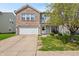 Charming two-story home with a brick and siding exterior and a well-maintained front yard and a two-car garage at 350 Springfield Cir, Greenwood, IN 46143