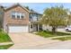 Attractive two-story home featuring a mix of brick and siding, complemented by a well-kept lawn and a two-car garage at 350 Springfield Cir, Greenwood, IN 46143