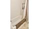 Clean bathroom featuring a tub, shower with curtain, and tiled walls at 3601 N Oakwood Ave, Muncie, IN 47304