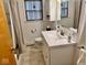 Modern bathroom featuring a vanity, mirror, and shower with neutral color palette at 3601 N Oakwood Ave, Muncie, IN 47304