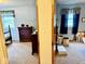 Cozy bedroom featuring matching dark wood dressers and decor, and light blue walls at 3601 N Oakwood Ave, Muncie, IN 47304