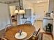 Inviting dining area featuring a wood table, chairs, and a view into the adjacent living space at 3601 N Oakwood Ave, Muncie, IN 47304