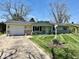 Charming single-story home featuring a well-maintained lawn and attached one car garage at 3601 N Oakwood Ave, Muncie, IN 47304
