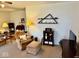 Comfortable living room with cozy seating and a wall shelf display at 3601 N Oakwood Ave, Muncie, IN 47304