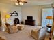 Well-lit living room featuring neutral walls and carpet at 3601 N Oakwood Ave, Muncie, IN 47304