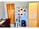 Bright office featuring a desk, storage, and view into an adjacent room at 3601 N Oakwood Ave, Muncie, IN 47304