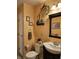 Cozy bathroom featuring stylish decor, a modern vanity, and warm, inviting colors at 3614 Thorncrest Dr, Indianapolis, IN 46234