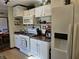 Functional kitchen featuring white cabinetry, essential appliances, and a bright, clean ambiance at 3614 Thorncrest Dr, Indianapolis, IN 46234
