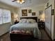 Comfortable primary bedroom with a large bed, ornate decor, and ample natural light at 3614 Thorncrest Dr, Indianapolis, IN 46234