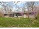 Back exterior view of home with a landscaped yard at 3636 E 71St St, Indianapolis, IN 46220