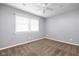 Cozy bedroom with neutral walls, plush carpet, and a bright window at 3636 E 71St St, Indianapolis, IN 46220