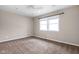 Bedroom with neutral walls, plush carpet, a ceiling fan and double windows for lots of light at 3636 E 71St St, Indianapolis, IN 46220