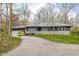 A home's front exterior with driveway and partial garage view at 3636 E 71St St, Indianapolis, IN 46220