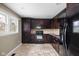 Well-equipped kitchen featuring dark wood cabinets and modern appliances at 3636 E 71St St, Indianapolis, IN 46220