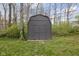 Exterior view of a dark-colored shed in the backyard at 3636 E 71St St, Indianapolis, IN 46220
